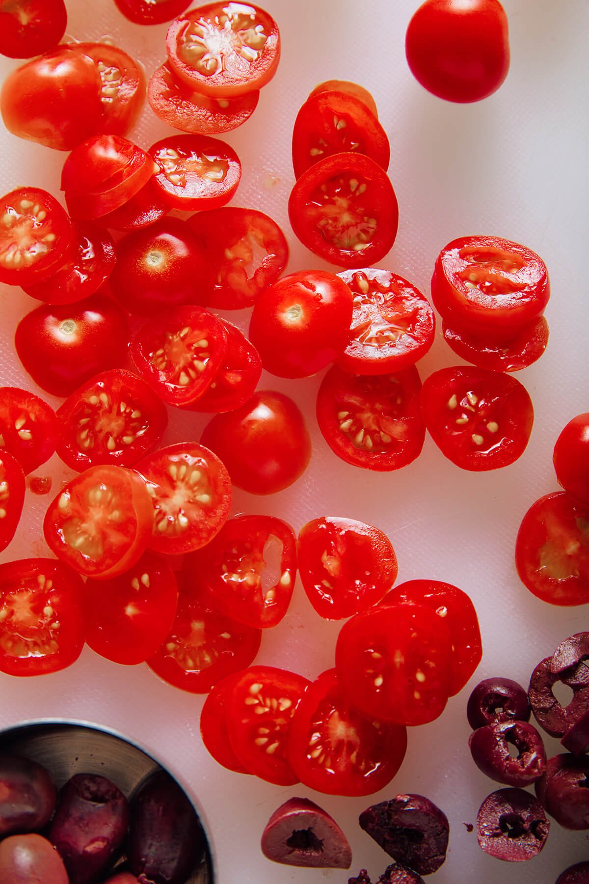 sliced cherry tomatoes and kalamata olives