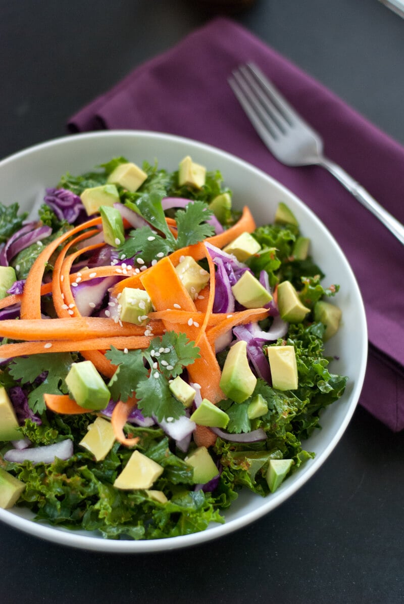 Kale salad with avocado, carrots, and ginger-red pepper dressing Kale salad with avocado, carrots, and ginger-red pepper dressing