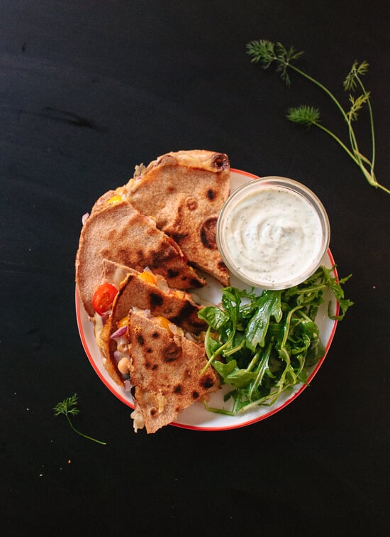 Tomato, olive and chickpea quesadilla with dill yogurt dip