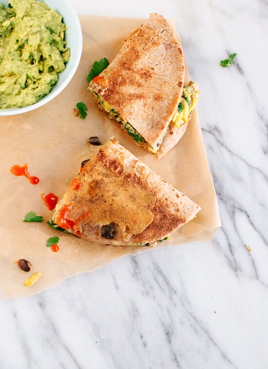 Vegetarian scrambled egg quesadillas with spinach, black beans and guacamole! cookieandkate.com