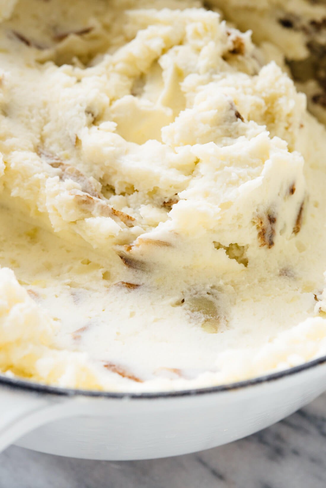 My family's favorite mashed potatoesโthey're ultra creamy, a little tangy, and you can make them ahead! #Thanksgiving