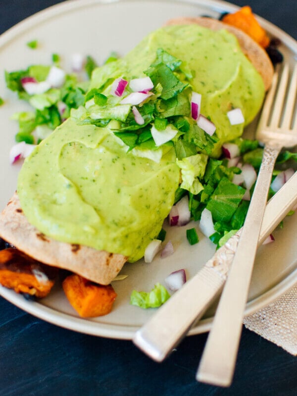 Sweet potato burrito smothered with avocado salsa verde